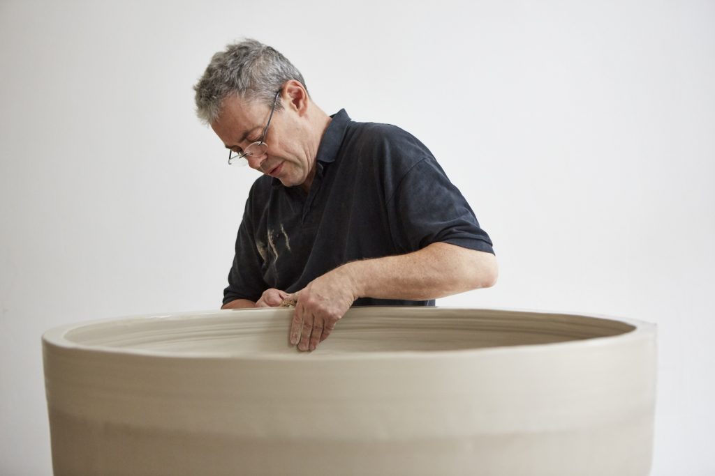 Julian Stair throwing a large cup in his studio. Photo: Jan Baldwin Photograph of Julian Stair working on a large cup in his studio