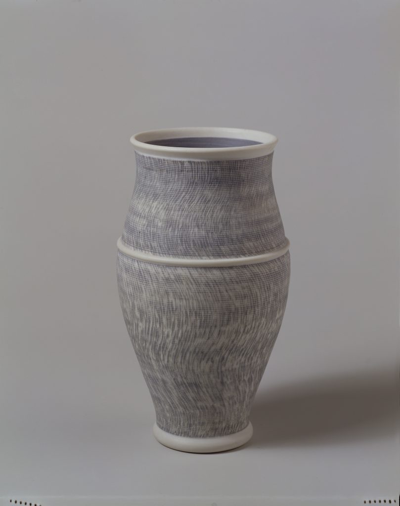 Julian Stair, vase, c.1983. © Julian Stair A white vase by Julian Stair crossed with blue lines