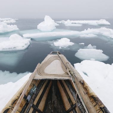 A photograph of a boat in the Arctic