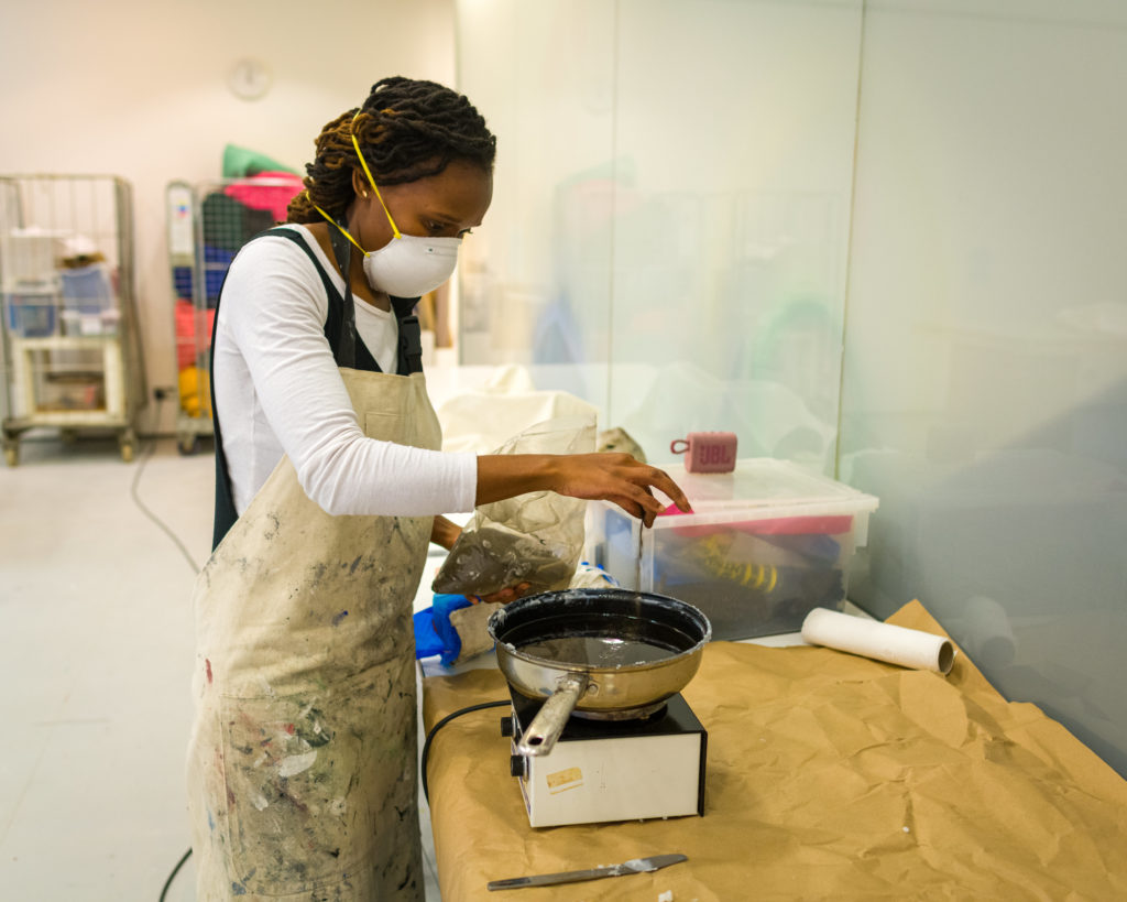 Msezane in the process of creating work for her exhibition at the Sainsbury Centre. Photo: Andy Crouch Photograph of South African artist Sethembile Msezane preparing an artwork