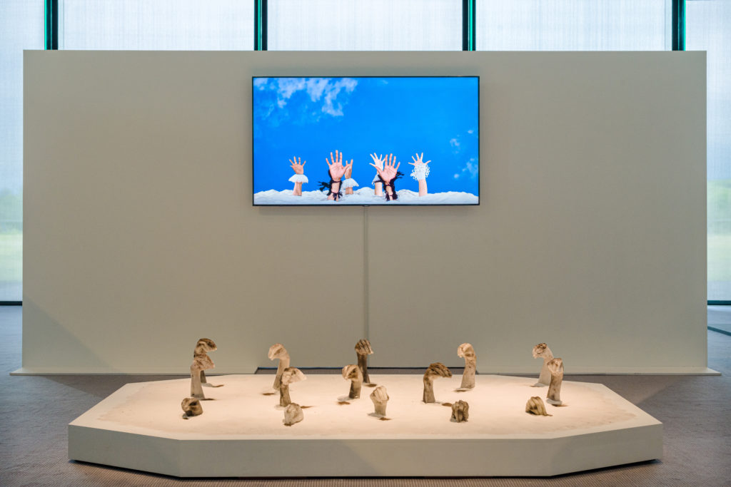20210604_Sainsbury Centre_0013 Installation view from the exhibition Sethembile Msezane: Nibizwa Ngabangcwele, featuring video art on a television screen and wax sculptures in the shape of hands