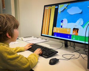 A Sainsbury Centre visitor testing the game Within the Dream by Samara Goss.