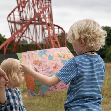 Kids_Sainsbury-Centre_Sculpture-Park_August-2024.-Photo--Kate-Wolstenholme Young visitors enjoying the Sculpture Park Pocket Map, photo by Kate Wolstenholme.