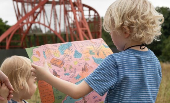 Kids_Sainsbury-Centre_Sculpture-Park_August-2024.-Photo--Kate-Wolstenholme Young visitors enjoying the Sculpture Park Pocket Map, photo by Kate Wolstenholme.