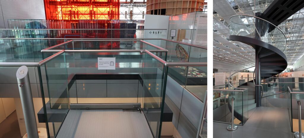 A lift and a spiral staircase in an art museum